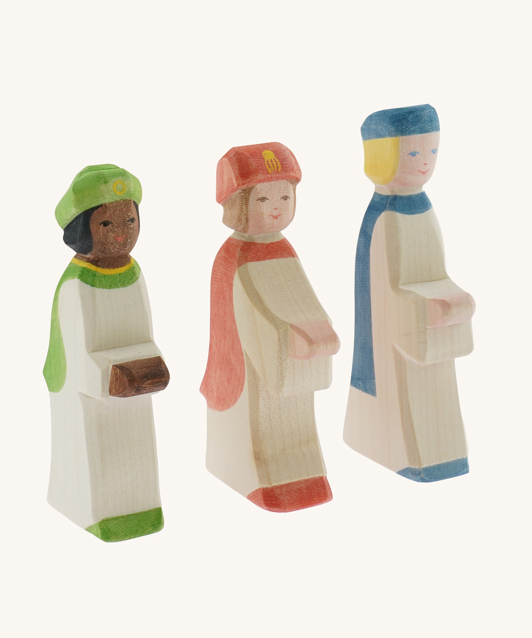 A collection of three Ostheimer  King's Page Three Wise Men Wooden Nativity Figures in green, blue and red outfits. These wooden figures are part of a wide range of expertly hand crafted wooden toys here at Babipur. 