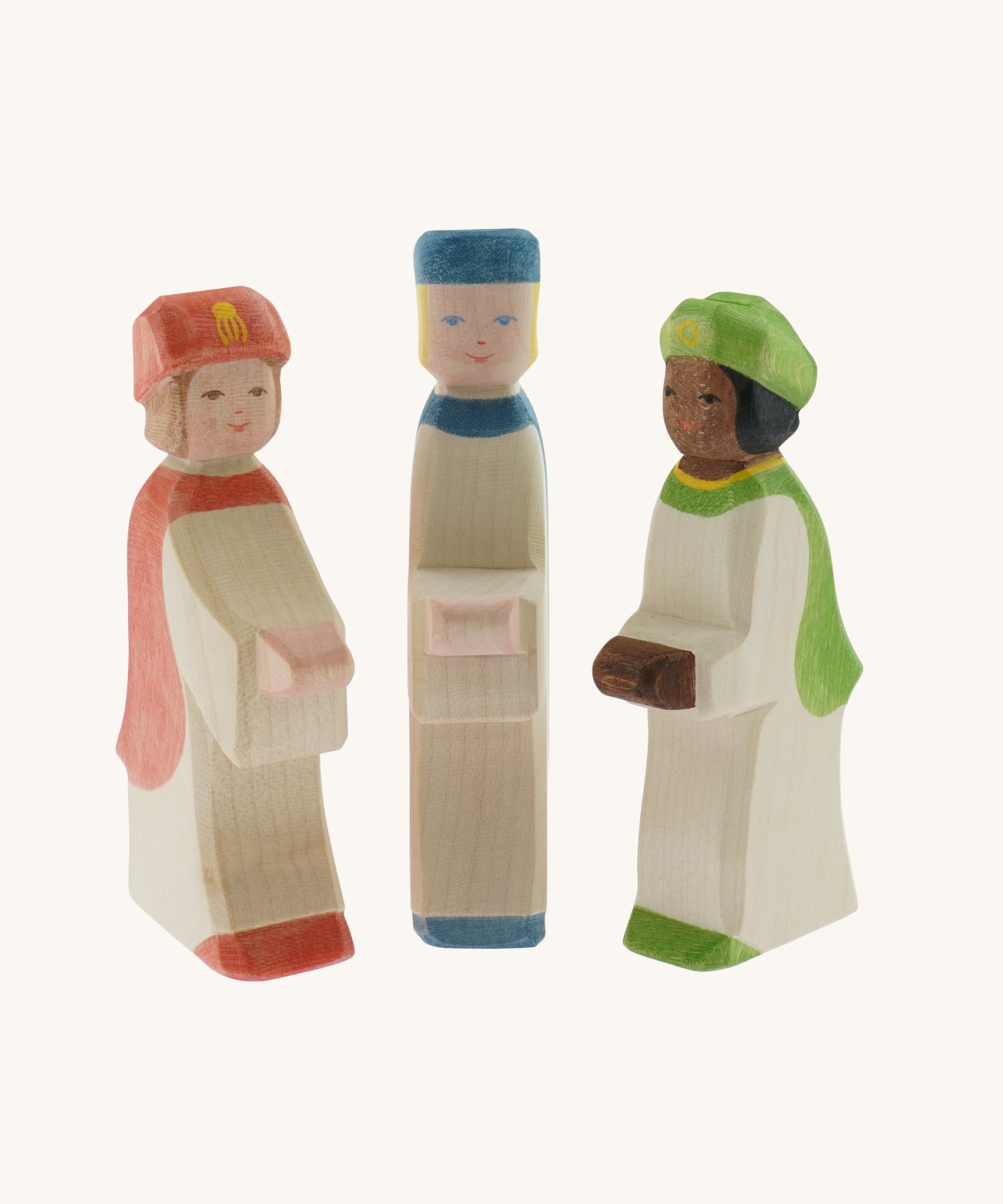A collection of three Ostheimer  King's Page Three Wise Men Wooden Nativity Figures in green, blue and red outfits. These wooden figures are part of a wide range of expertly hand crafted wooden toys here at Babipur. 