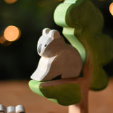 An Ostheimer sitting Koala figure placed on the eucalyptus tree wooden toy. 