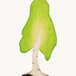 A large wooden birch tree figure on a cream background