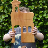 Ostheimer large wooden lookout tower wooden toy in a child's hands.