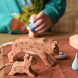 Ostheimer adult and small running leopard placed on a brown cloth in a small world play set up.