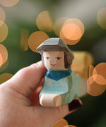 A close up of the face of the Ostheimer lying shepherd wooden toy figure. These wooden figures are part of a wide range of expertly hand crafted wooden toys here at Babipur. 