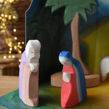 Ostheimer Joseph and Mary handmade wooden toy figures placed in  small world play scene.