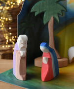 Ostheimer Joseph and Mary handmade wooden toy figures placed in  small world play scene.