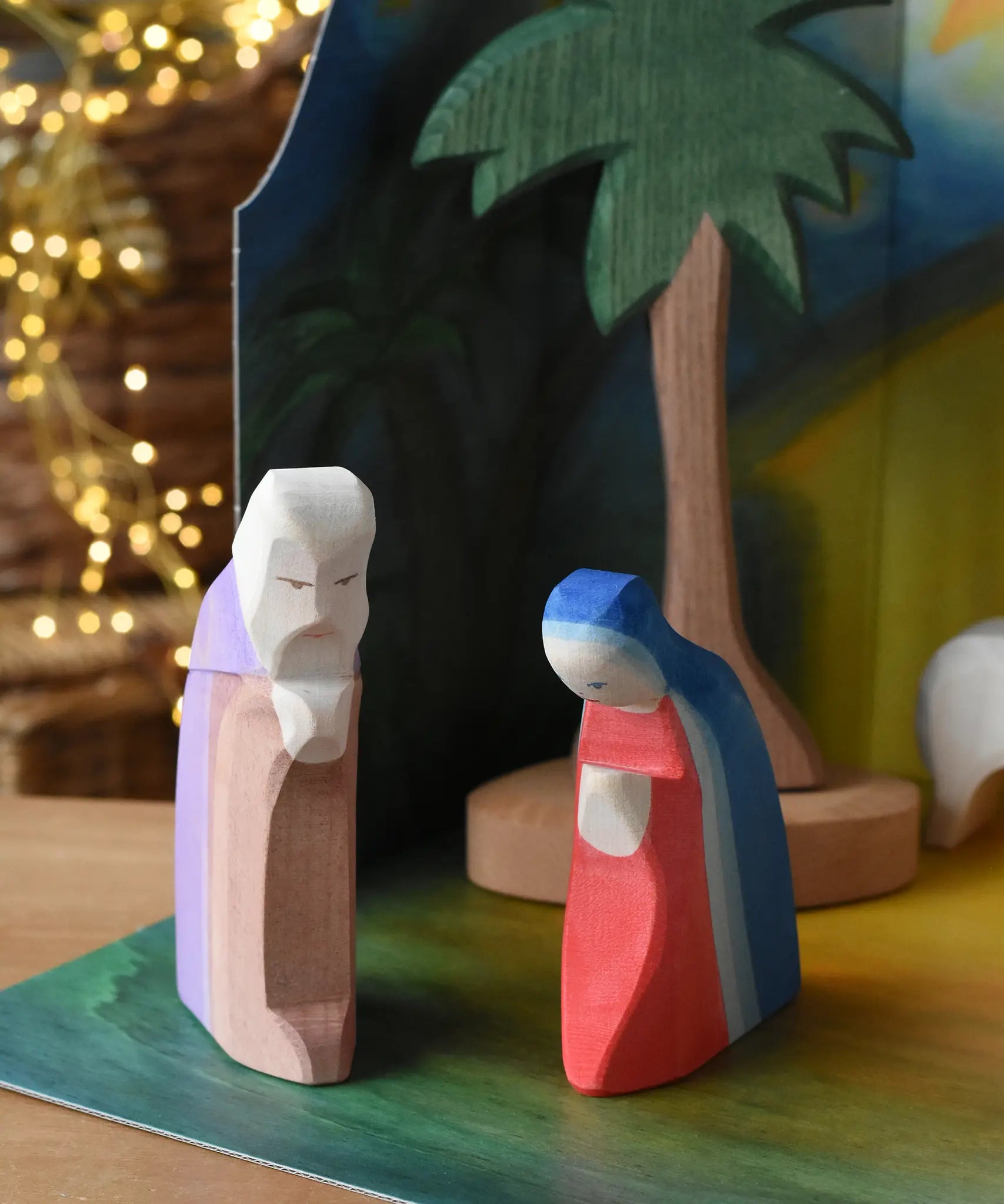 Ostheimer Joseph and Mary handmade wooden toy figures placed in  small world play scene.