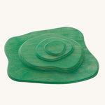 Ostheimer green Meadow wooden toy plates on a plain background. 