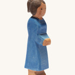 Ostheimer mother figure with brown skin on a plain background.