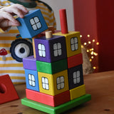Child playing with the Ostheimer multi coloured block house.
