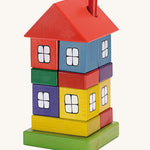 Ostheimer Multi Coloured Block House wooden toy on a plain background. 