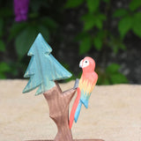An Ostheimer multi-colour parrot placed on a fir tree for dwarves.