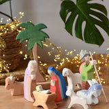 Ostheimer wooden toy nativity set set up on a wooden surface. 