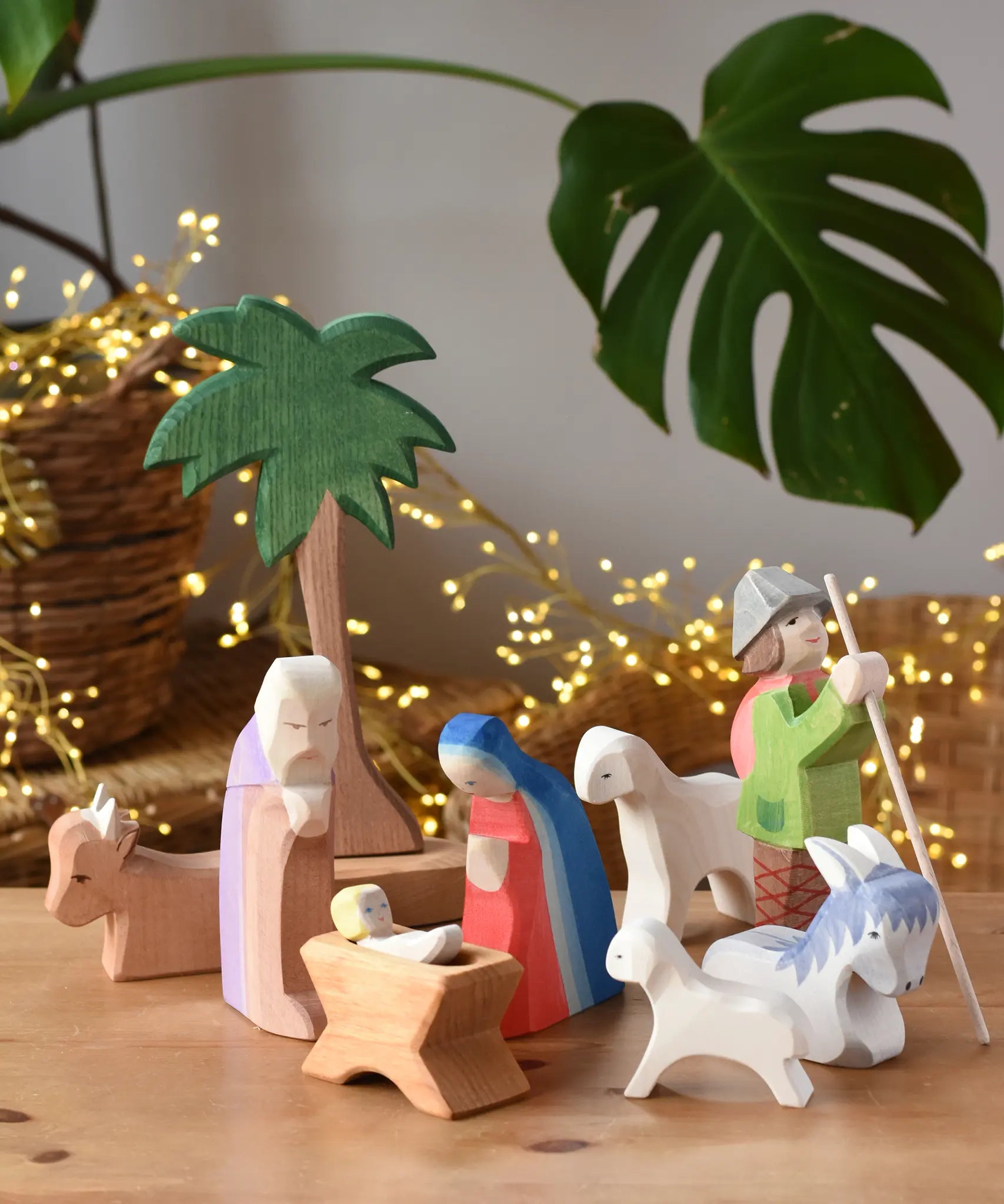 Ostheimer wooden toy nativity set set up on a wooden surface. 