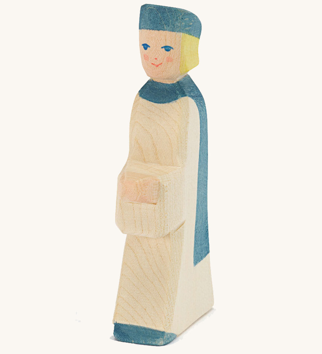 Ostheimer Blue King’s Page wooden nativity figure, a Waldorf inspired Star Singer with white skin and blond hair, wearing a white robe with a blue cloak and blue hat, hand painted 