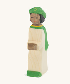 Ostheimer Green King’s Page wooden nativity figure, a Waldorf inspired Star Singer with black skin and black hair, wearing a white robe with a green cloak and green hat, hand painted 