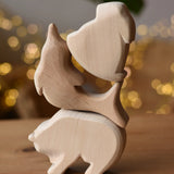 Three Ostheimer natural  wooden rabbit wooden toy figures stack on top of each other, bear, dolphin and rabbit..