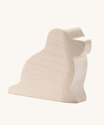 Ostheimer paint your own dog figure on a plain background. A natural, unpainted wooden figure ready for you to decorate yourself. 