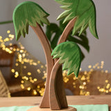 Ostheimer palm tree group with support base placed on green cotton play cloths.