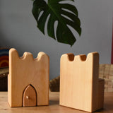 Ostheimer wooden castle parapets pieces placed on a wooden surface.