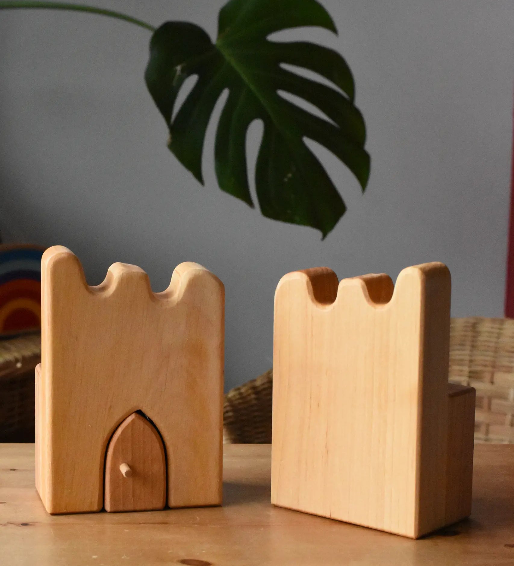 Ostheimer wooden castle parapets pieces placed on a wooden surface.