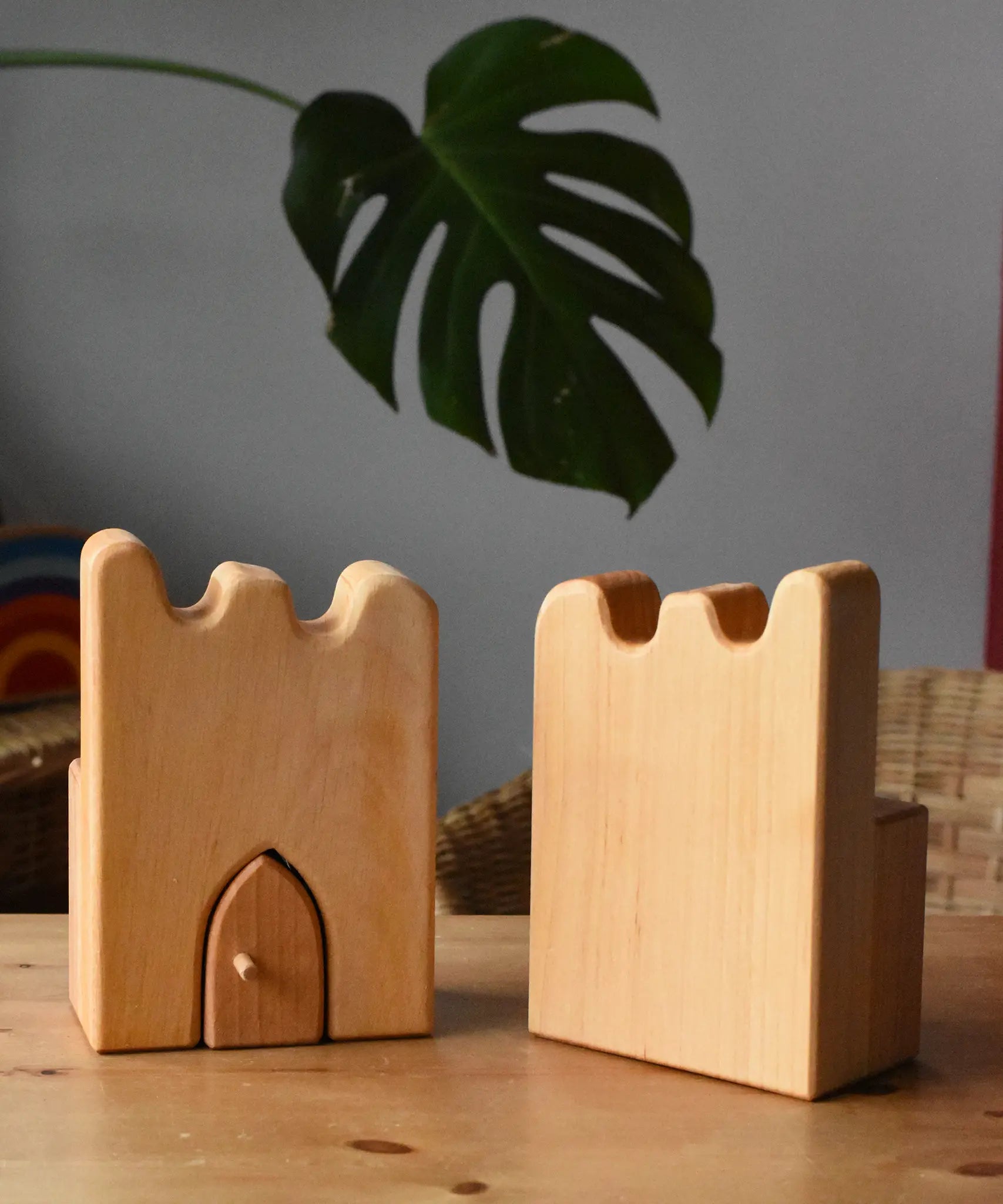 Ostheimer wooden castle parapets pieces placed on a wooden surface.