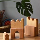 Ostheimer wooden castle parapets pieces with door taken out placed on a wooden surface.