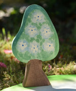 Ostheimer wooden golden pear tree shown on the blue flower blossom side on a pond scenery piece.
