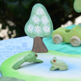 Ostheimer wooden golden pear tree shown on the blue flower side scenery piece used in a small world play set up with a pond piece and frogs. 
