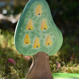 Ostheimer wooden golden pear tree shown on the golden pear fruit side on a pond scenery piece.