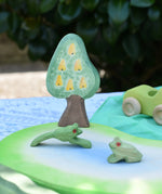 Ostheimer wooden golden pear tree scenery piece used in a small world play set up with a pond piece and frogs. 