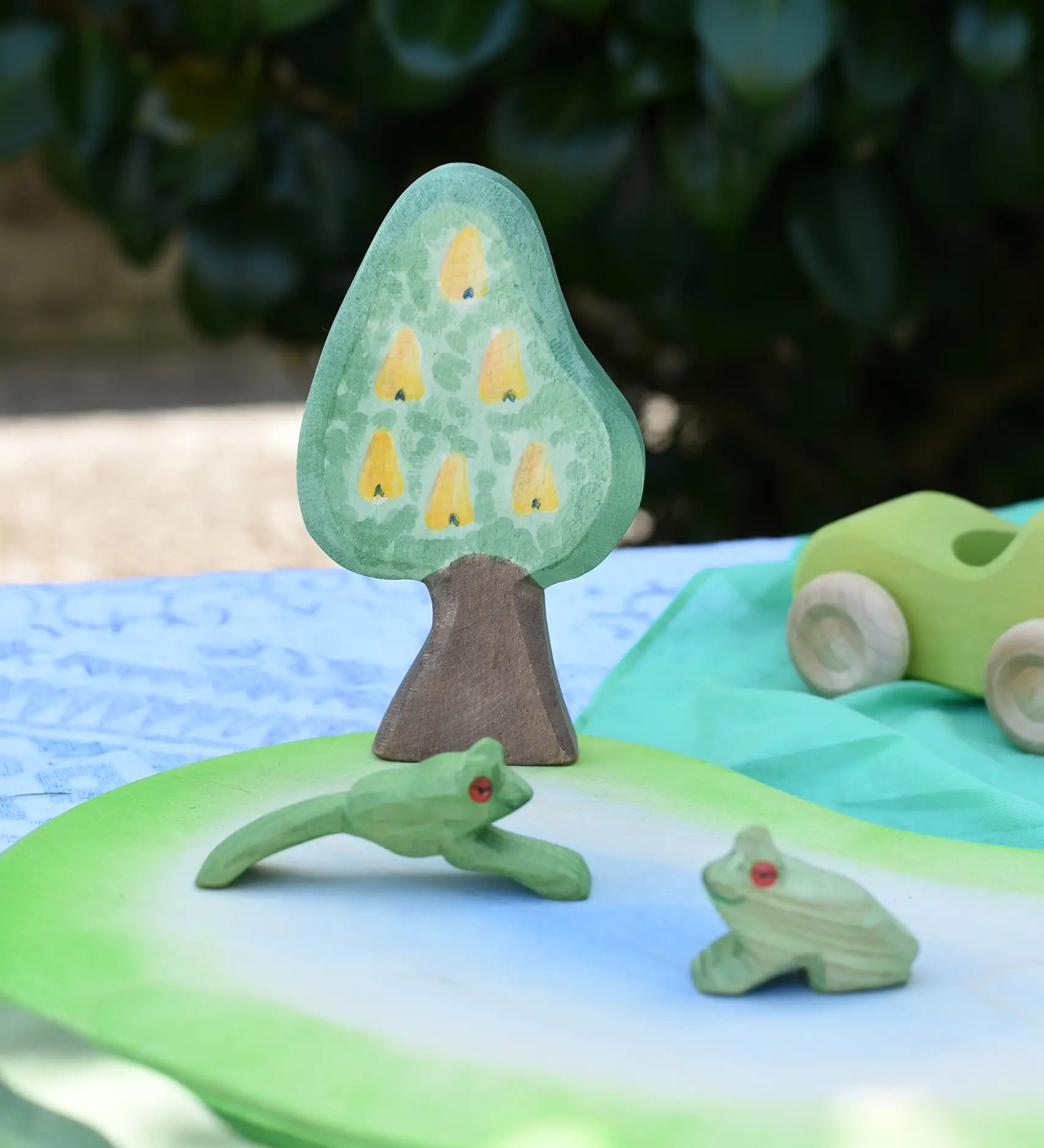 Ostheimer wooden golden pear tree scenery piece used in a small world play set up with a pond piece and frogs. 