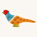Ostheimer pheasant wooden toy figure on a plain background. 