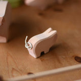 A close up of the tail on the Ostheimer wooden toy pink piglet figure. These wooden figures are part of a wide range of expertly hand crafted wooden toys here at Babipur. 