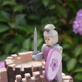 An Ostheimer pink knight placed on the turret of a Magic Wood castle. This wooden figure is part of a large range of expertly hand crafted wooden toys here at Babipur. 