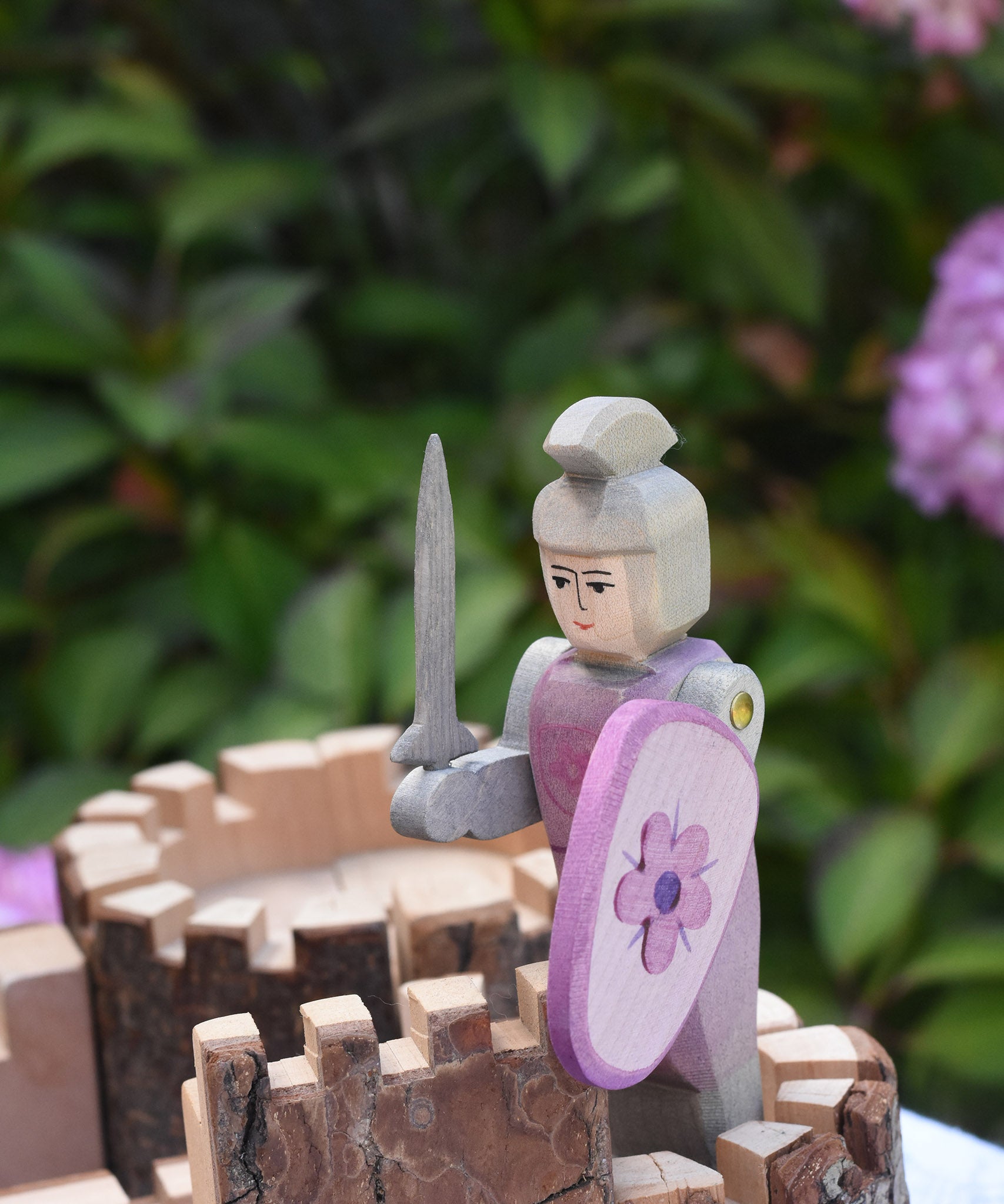 An Ostheimer pink knight placed on the turret of a Magic Wood castle. This wooden figure is part of a large range of expertly hand crafted wooden toys here at Babipur. 