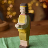 Ostheimer prince wooden toy figure placed on a green cotton play cloth. 