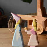 Side on view of the Ostheimer medieval and frog king princess placed on a wooden surface.