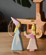 Side on view of the Ostheimer medieval and frog king princess placed on a wooden surface.