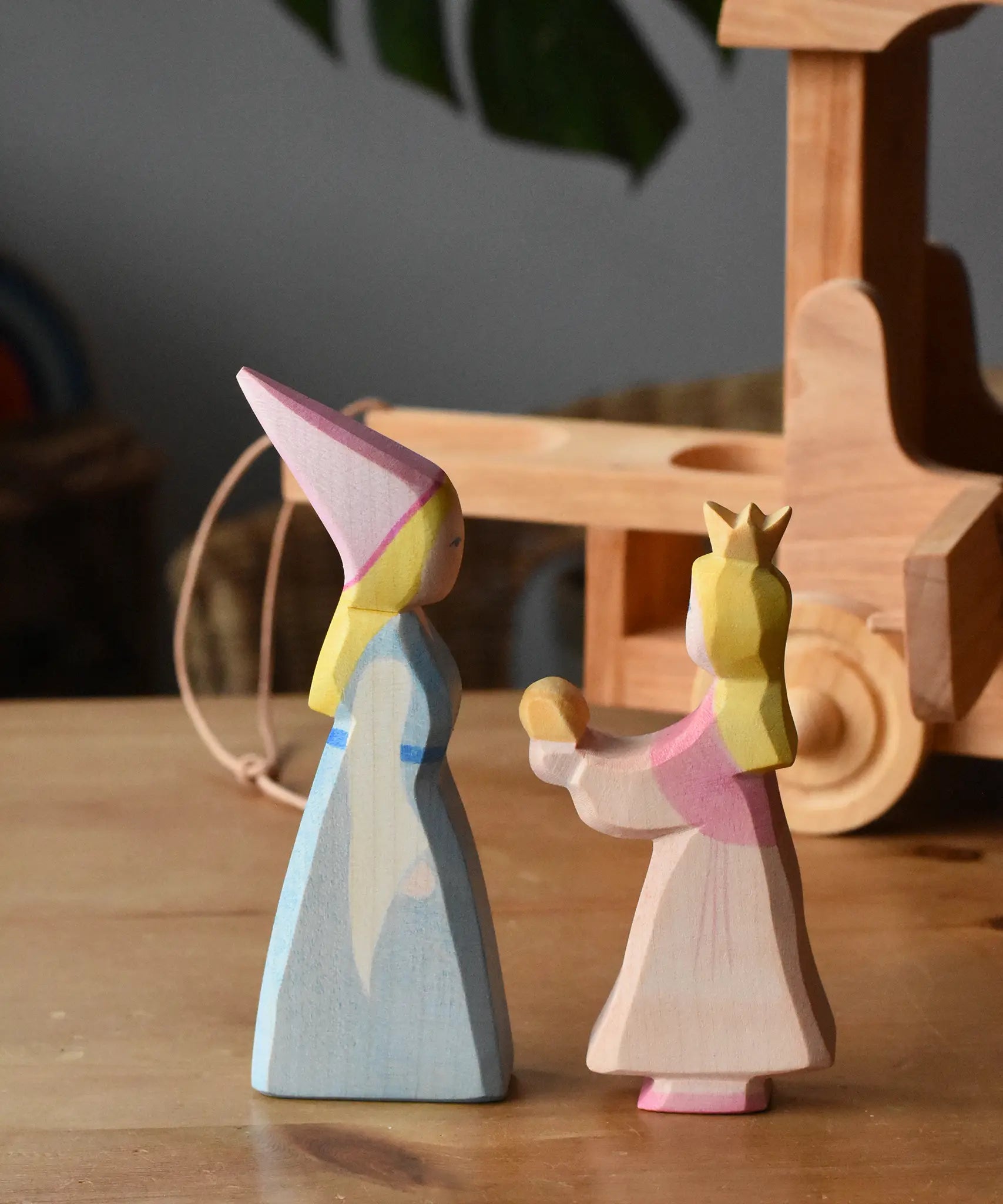 Side on view of the Ostheimer medieval and frog king princess placed on a wooden surface.