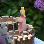 An Ostheimer pink princess for frog prince placed on the turret of a Magic Wood castle. This wooden figure is part of a large range of expertly hand crafted, Waldorf inspired, wooden toys here at Babipur. 