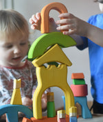 Ostheimer Rainbow Castle Blocks being stacked by a child.
