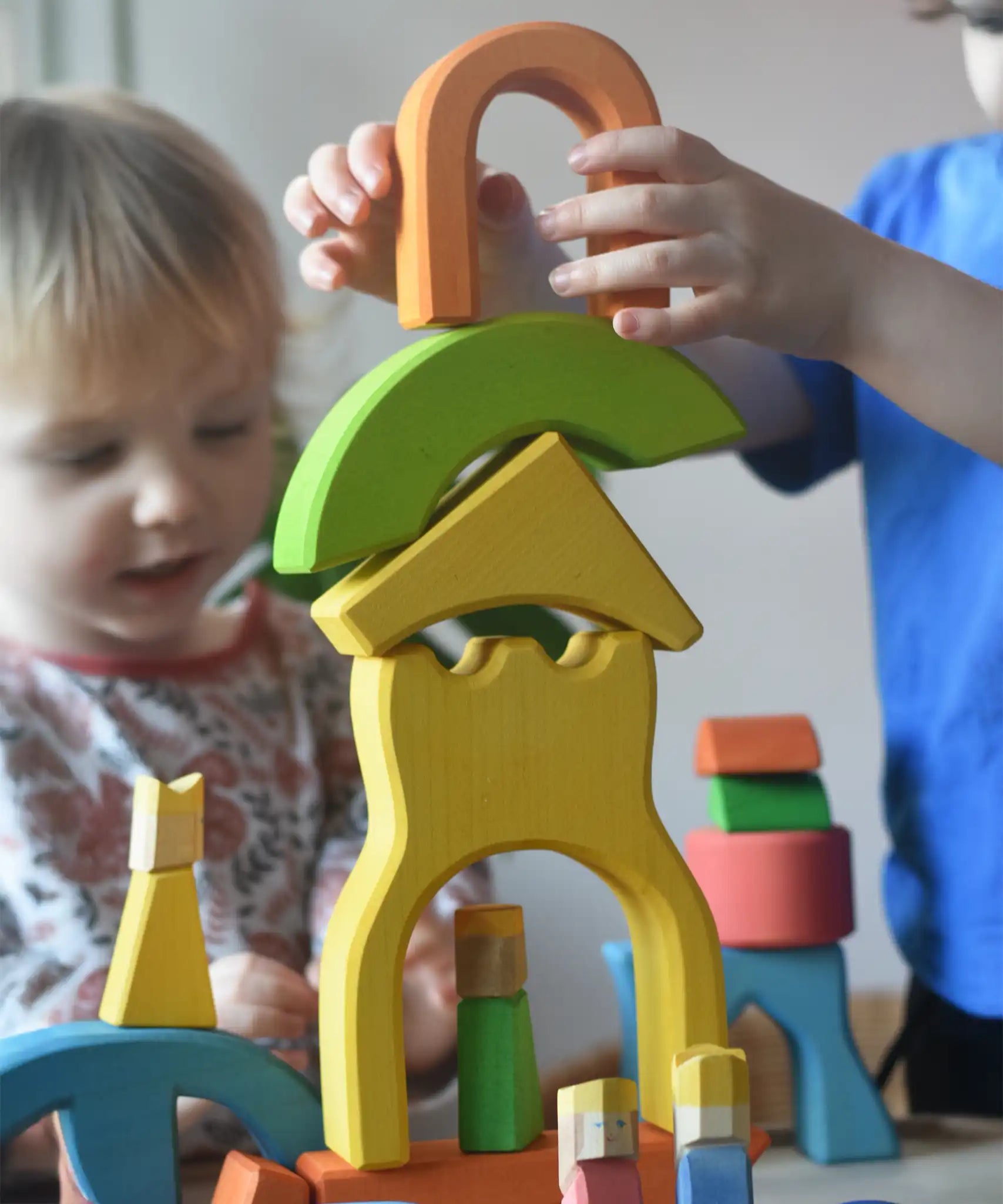 Ostheimer Rainbow Castle Blocks being stacked by a child.