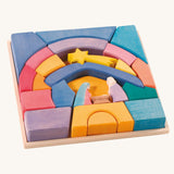The Ostheimer Rainbow Nativity Block set in the wooden frame they come with on a plain background.