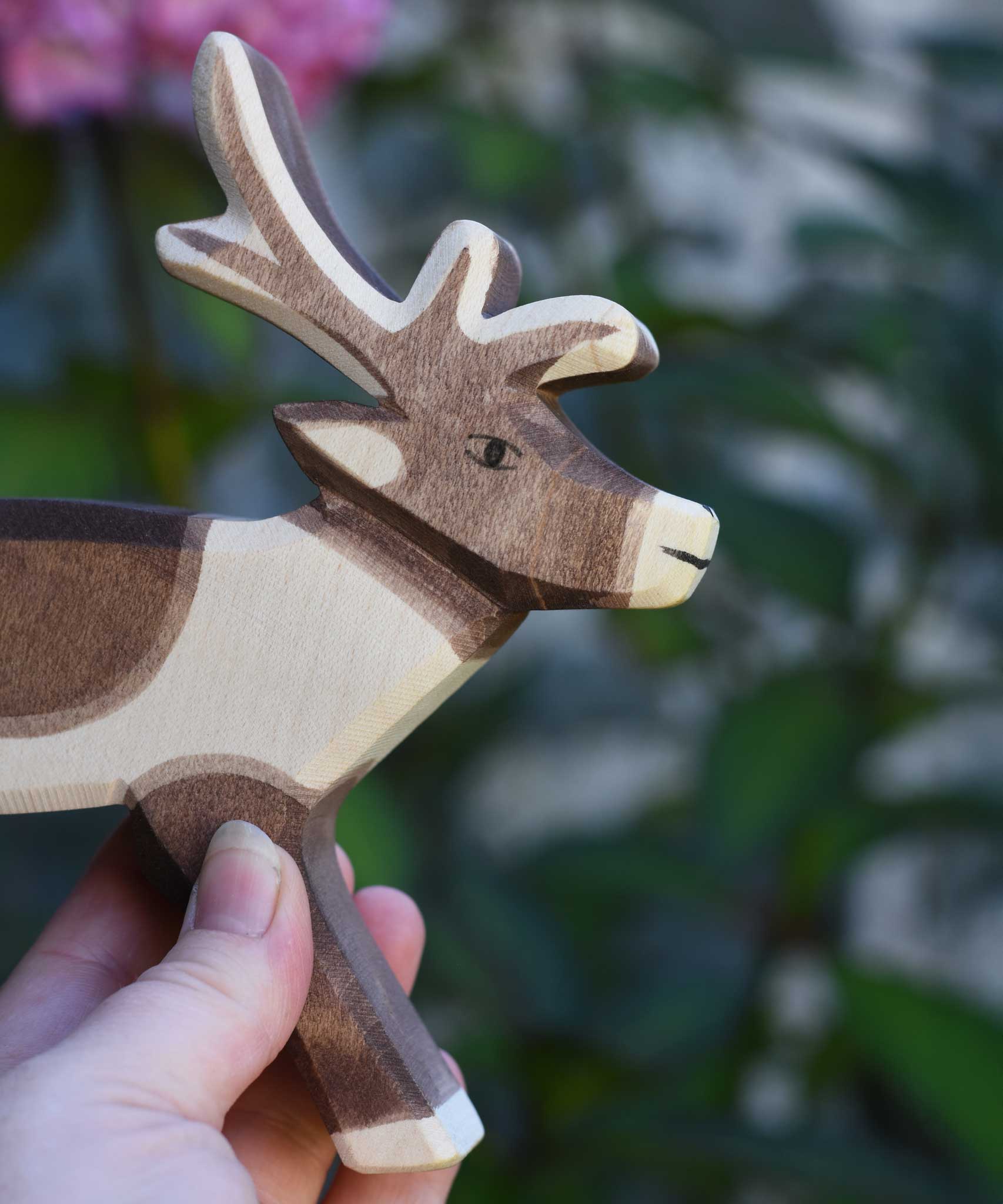 A close up of the face oh the Ostheimer reindeer figure. Check out our full range of expertly crafted wooden toy figures and scenery here at Babipur.