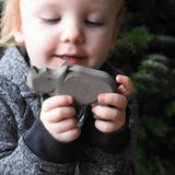 A child holding the small Ostheimer wooden toy figure. These wooden figures are part of a wide range of expertly hand crafted wooden toys here at Babipur.