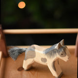 An Ostheimer shetland pony wooden toy figure placed in a pen created with Ostheimer wooden fence pieces.  Ostheimer's range of hand crafted, heirloom quality wooden toys are available to buy at Babipur. 