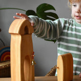 Child playing with the Ostheimer castle sentry post building with bell handmade wooden toy.