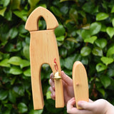 Ostheimer castle sentry post building with bell handmade wooden toy in a child's hand with the door in another hand.