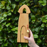 Ostheimer castle sentry post building with bell handmade wooden toy in a child's hand.