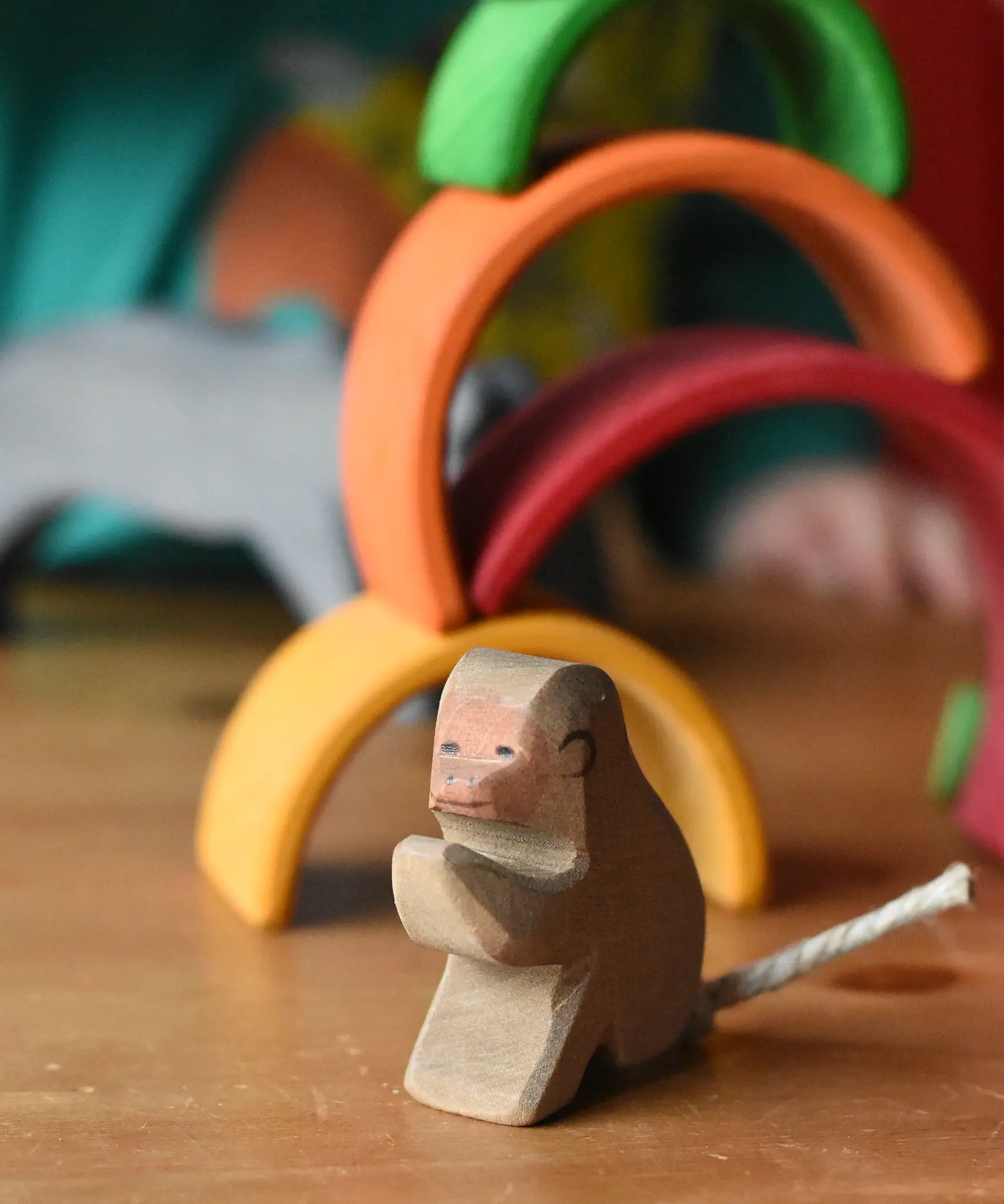Ostheimer sitting baboon wooden toy figure, close up of the front.